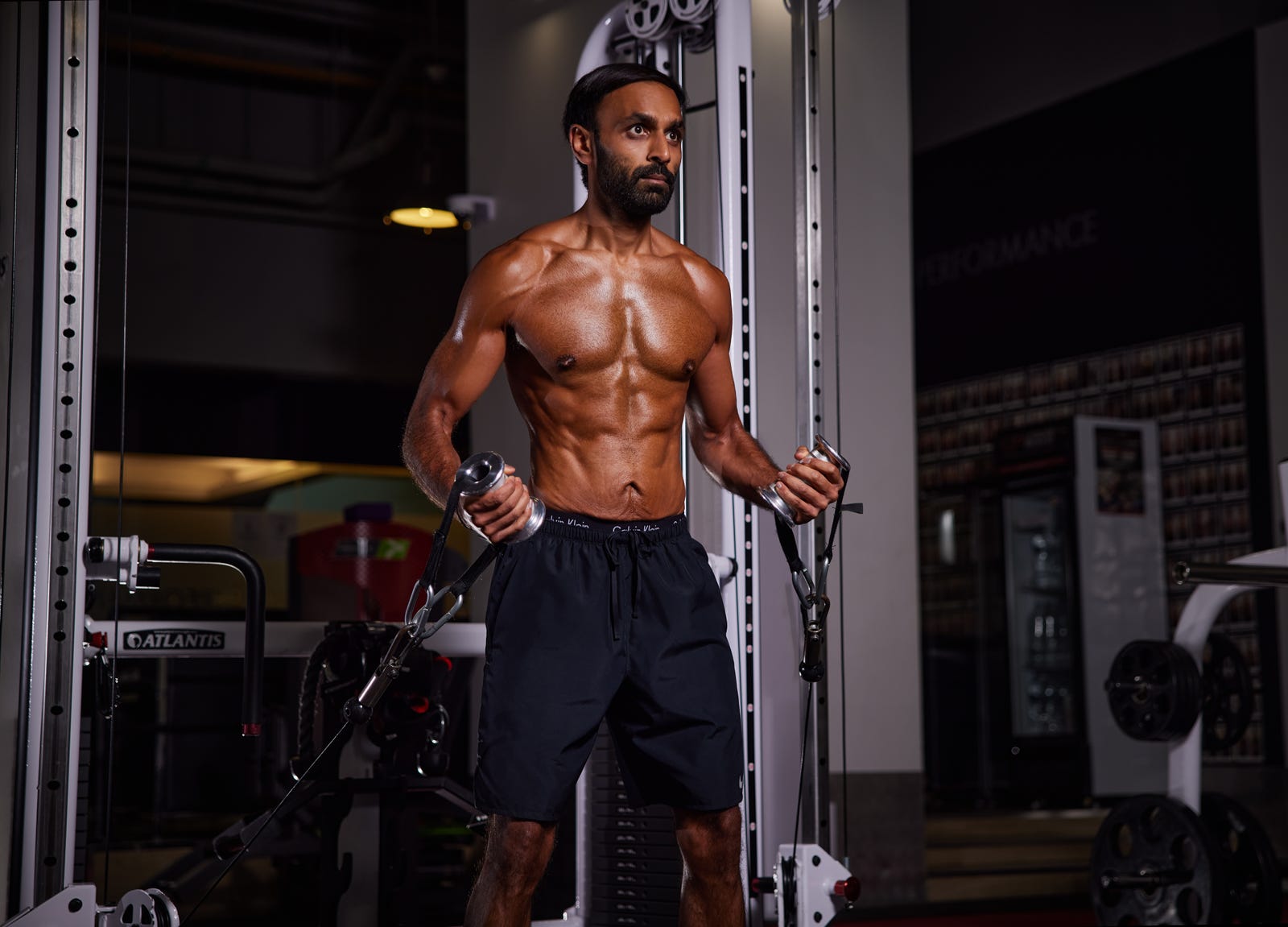 Vimal holding cable handles after his transformation, as featured in Men’s Health
